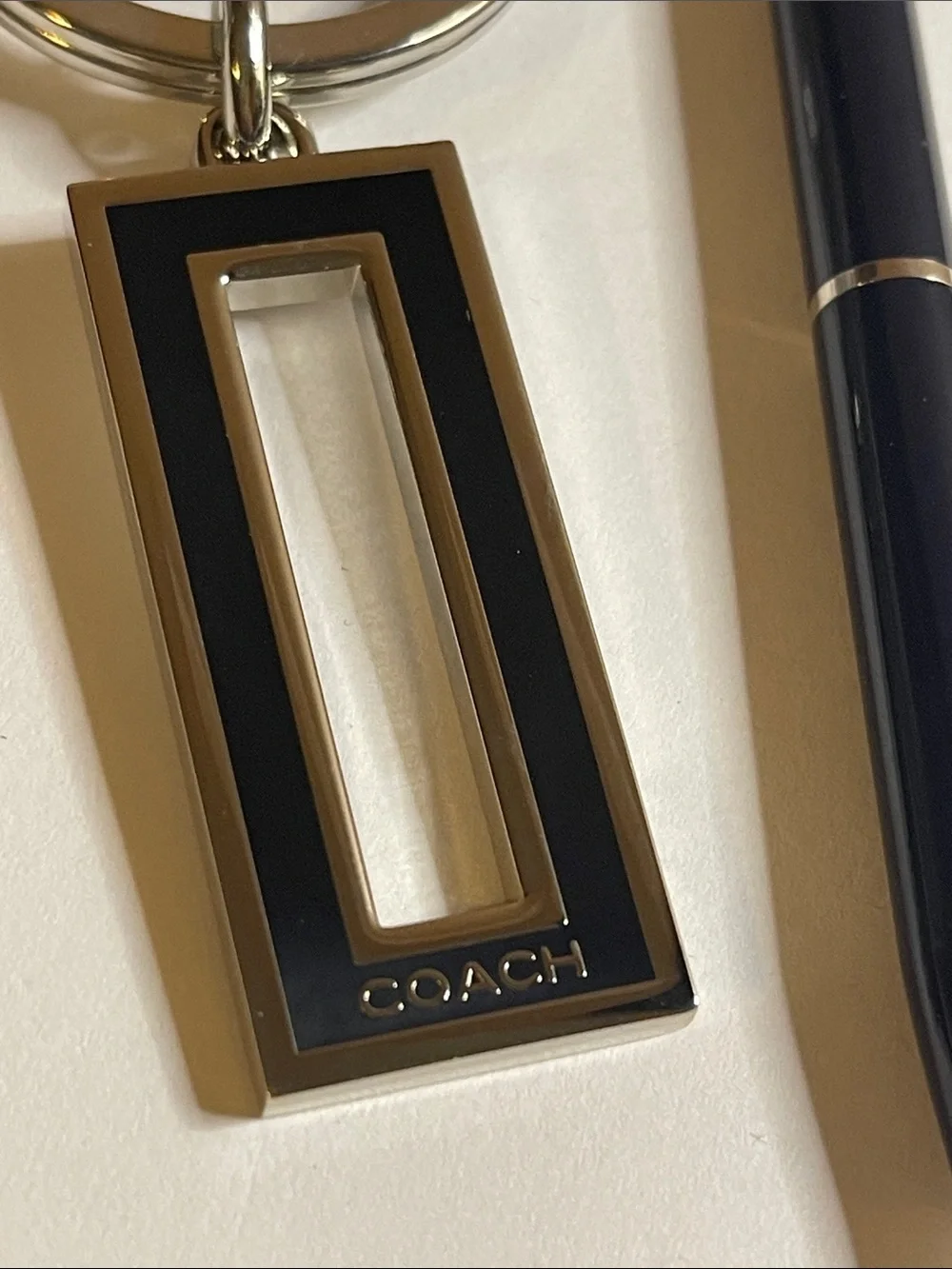 Coach Black and Silver Rectangular Keychain and Coach Pen
